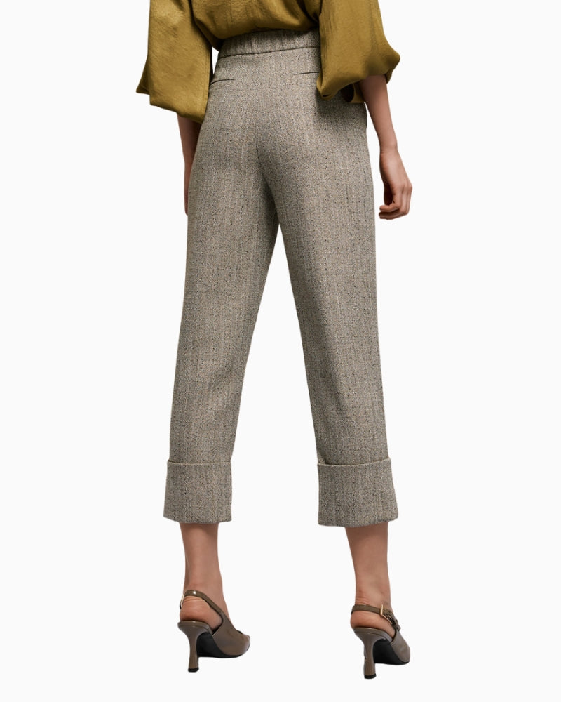 Back view of grey trousers with decorative welt pockets and neat finish