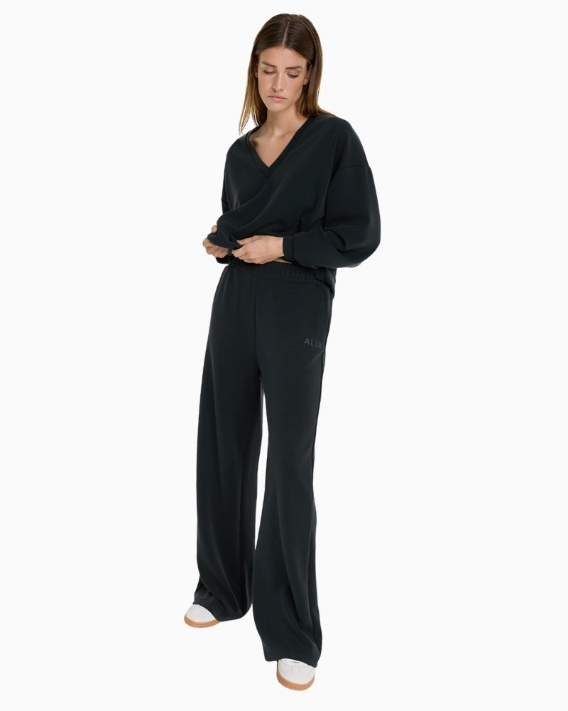 Alix The Label flowy black wide-leg pants in cupro-blend fabric with pockets