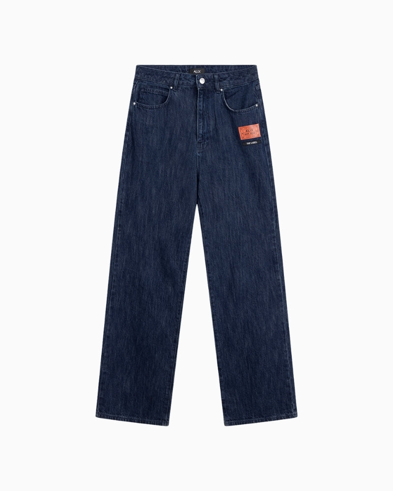 Front view of Alix indigo jeans with logo artwork on front panels