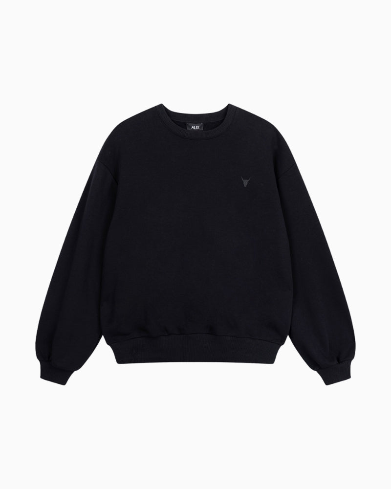 Front view of Alix black sweater with relaxed fit and ribbed neckline