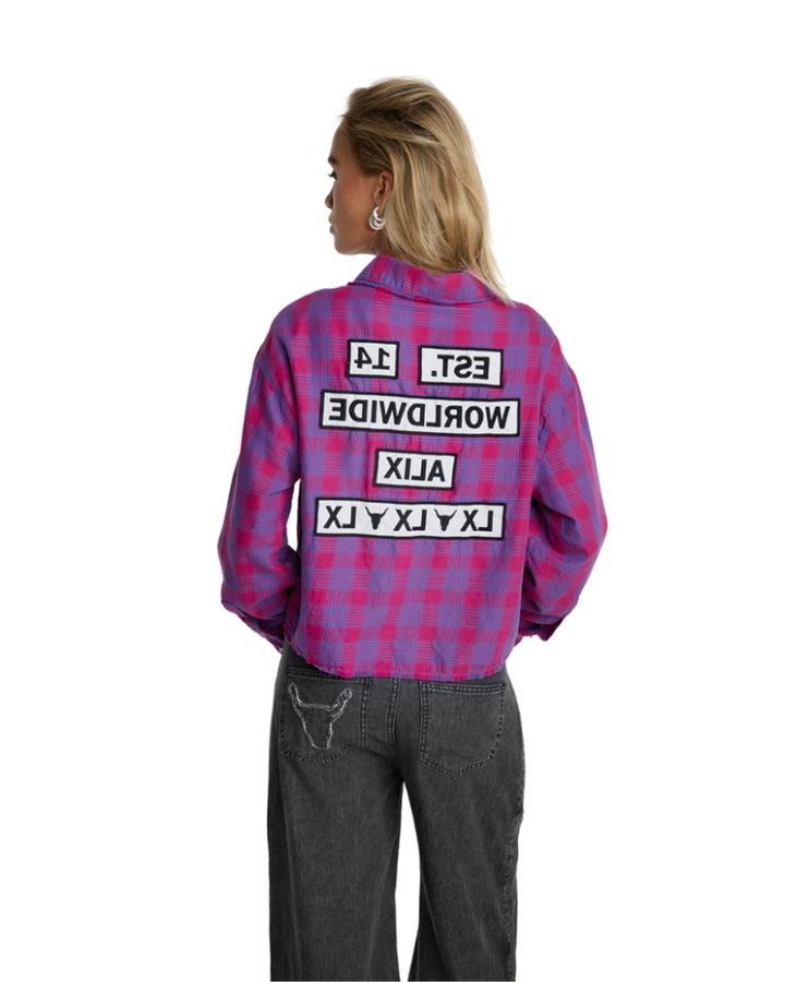 Back view of cropped blouse with bold slogan print