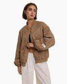 Alix The Label Plissé Bomber camel sleeve label detail