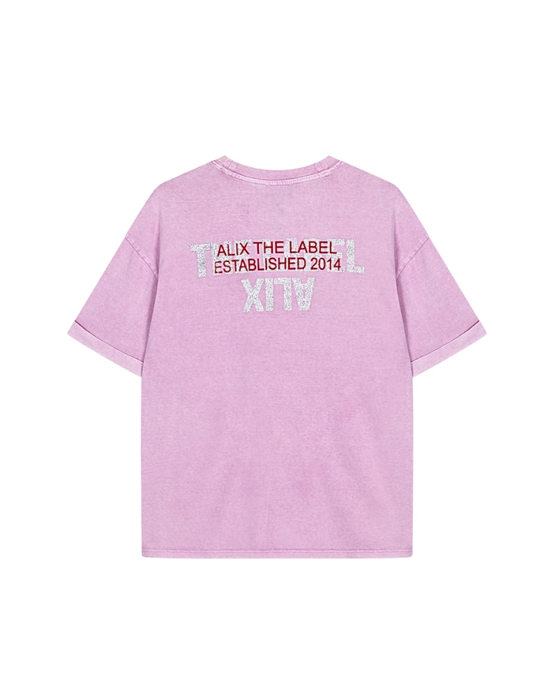 Flat lay back view of pink Alix the Label tee with subtle logo detail