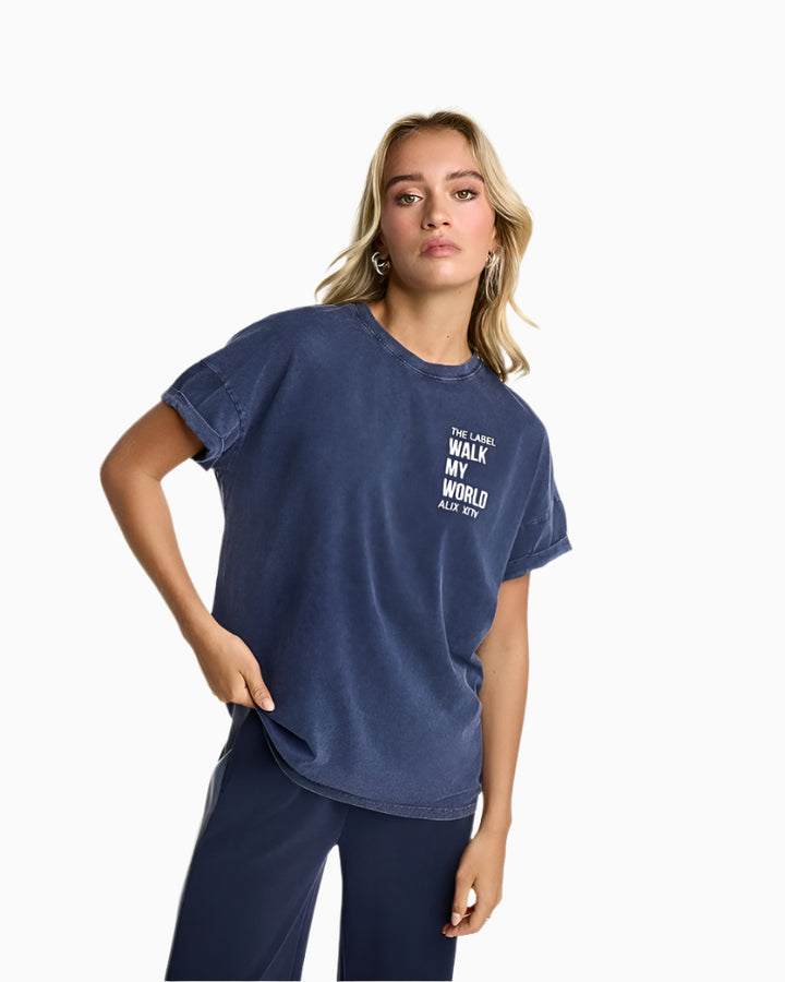 Model wearing Alix the Label Walk My World T-shirt in washed navy with relaxed fit