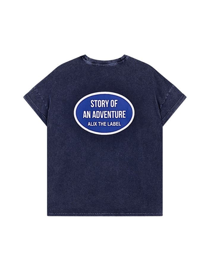 Back view of Walk My World T-shirt featuring bold oval logo graphic