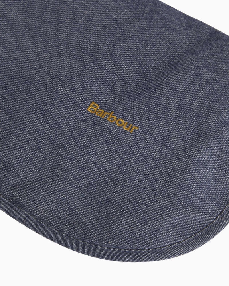 Close-up of Barbour denim dry wax dog coat embroidered logo – Áines Boutique