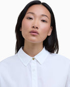 Close-up of Barbour Edith shirt brass button detail – Áines Boutique