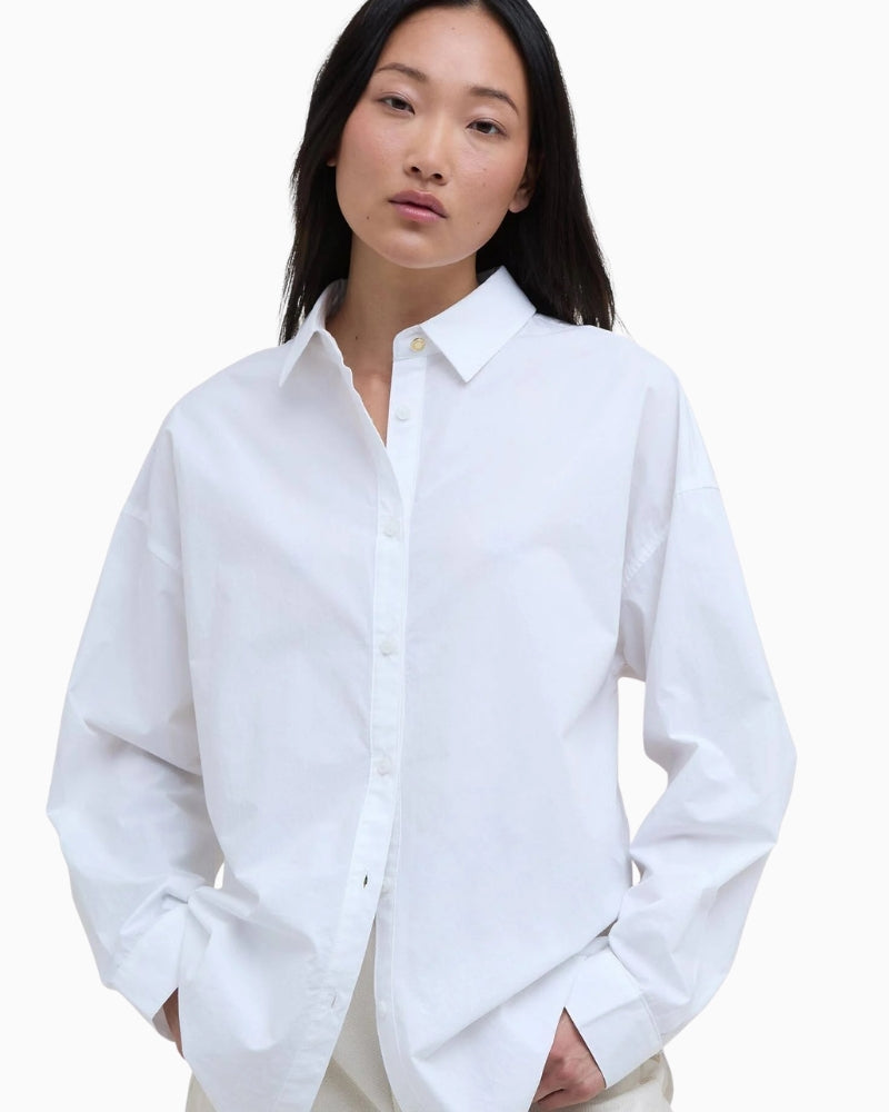 Close-up of Barbour Edith shirt brass button detail – Áines Boutique