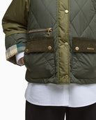 Close-up of cord collar and stud placket on Barbour quilted jacket