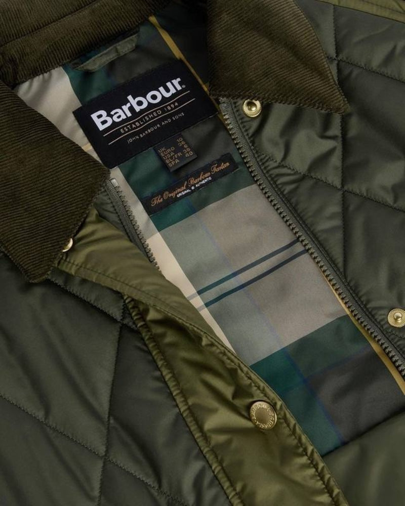 Interior of jacket with Barbour tartan lining and branded details