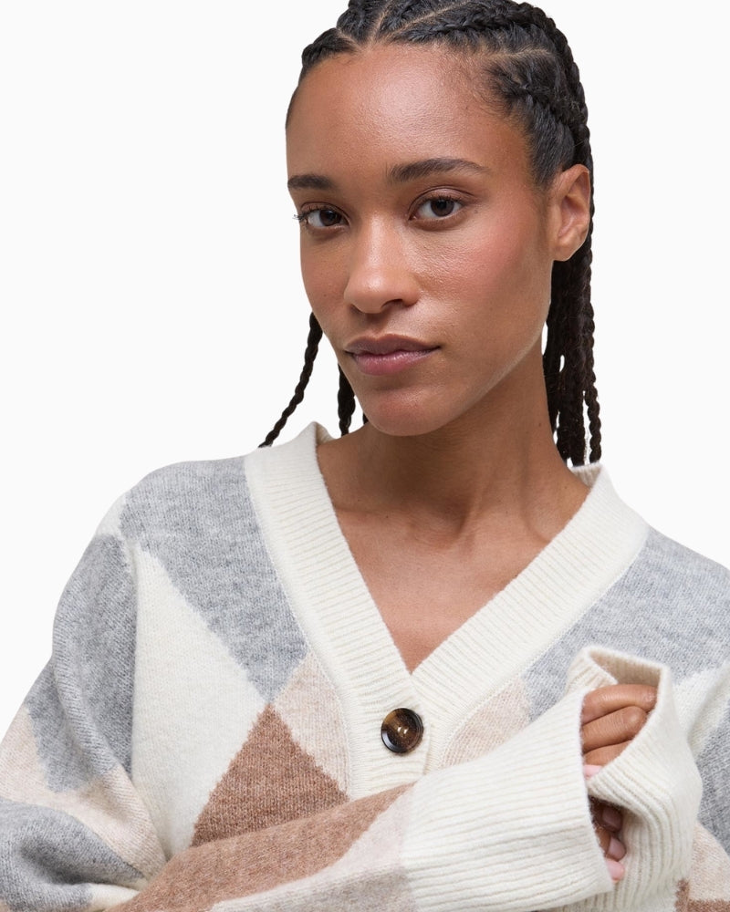 Close up of cropped Barbour knit with mock horn buttons