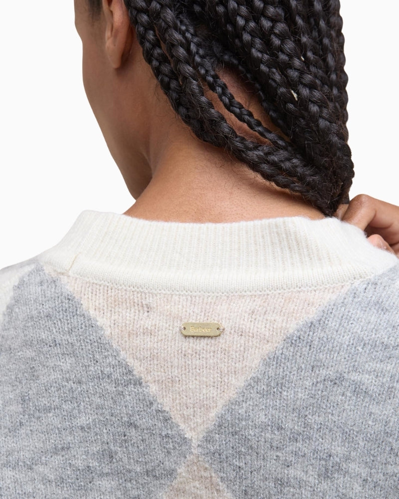 Close up of cropped Barbour knit with mock horn buttons