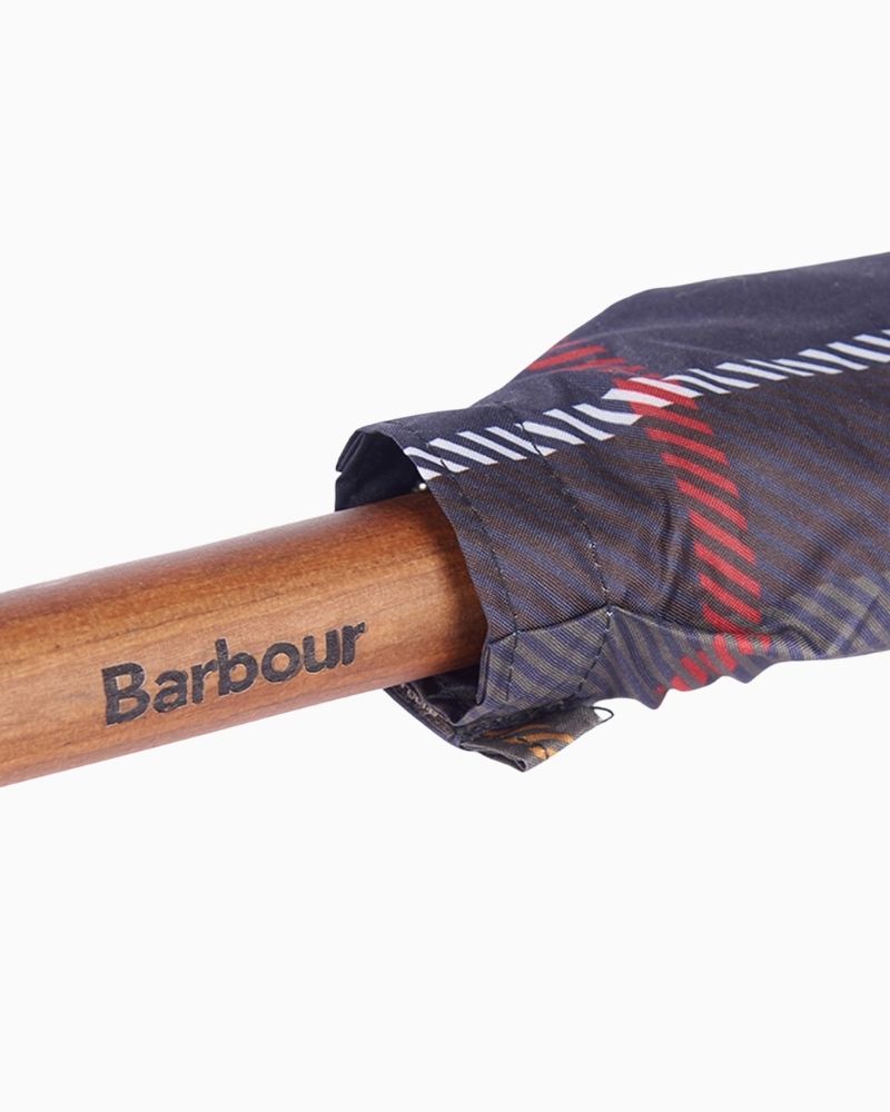 Close-up of Barbour tartan umbrella showing woven label and classic design