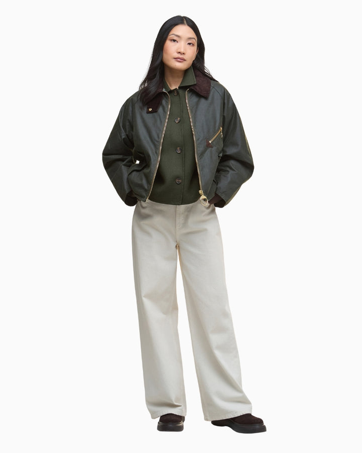 Model wearing olive Barbour Arlene Jacket styled with jeans, hands in pockets
