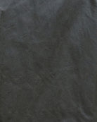 Close-up of fabric texture showing oiled cotton finish on Barbour Arlene Wax Jacket in olive