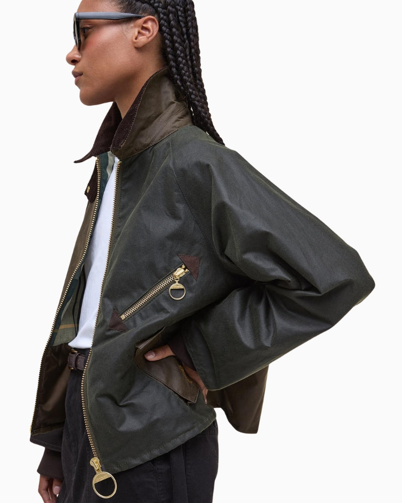 Side profile of Barbour Arlene waxed jacket showing cropped fit and long sleeves