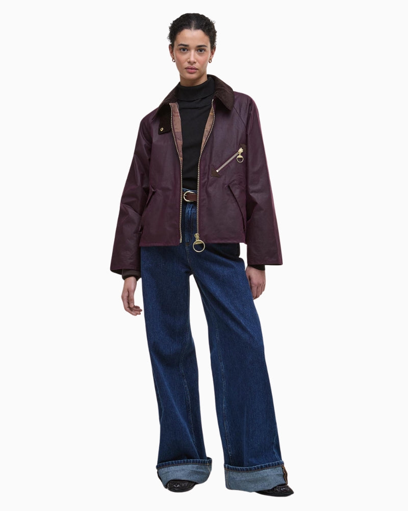 Model wearing Barbour Arlene rustic waxed jacket styled with trousers