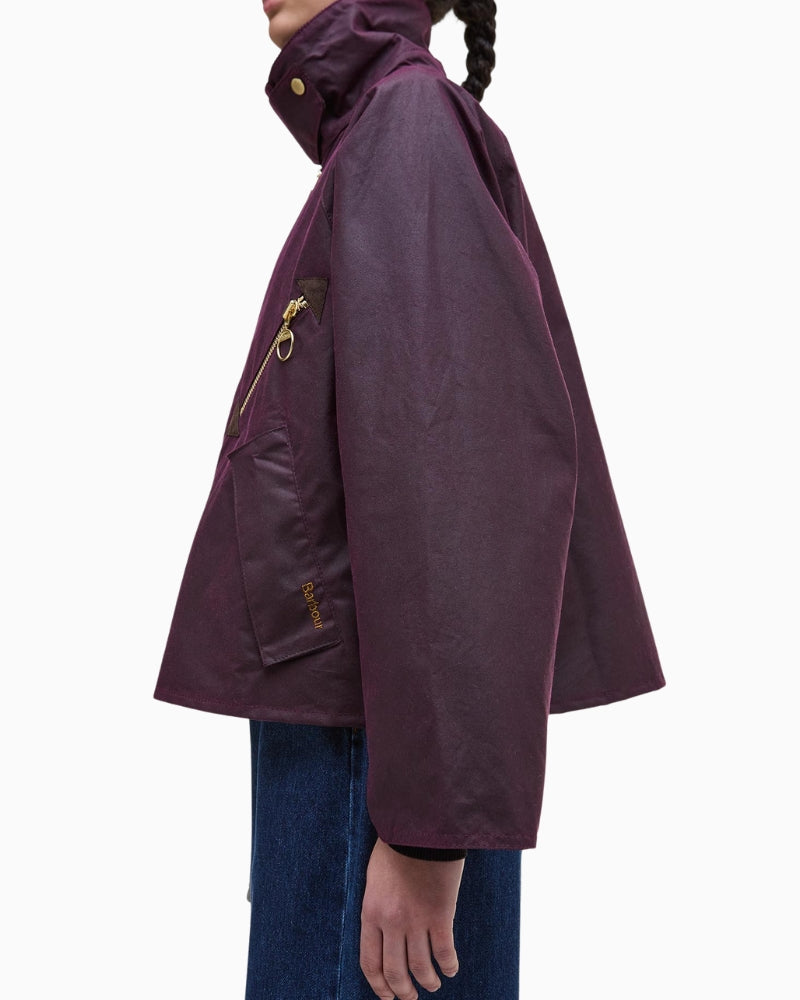 Side profile of Barbour Arlene rustic waxed cotton jacket showing cropped fit