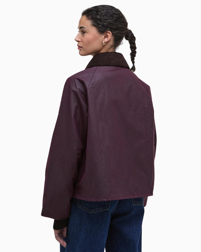Back view of Barbour Arlene rustic waxed jacket with ribbed cuffs and neat cropped cut