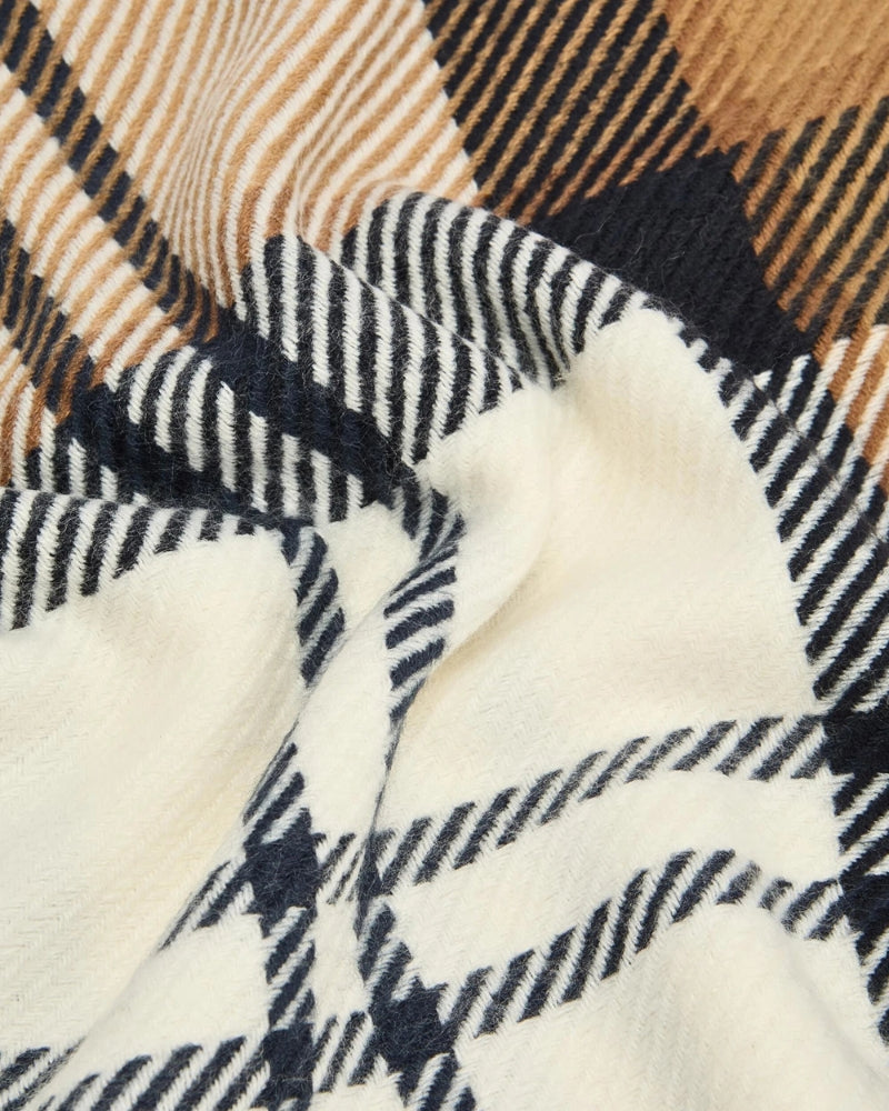 Close up view of Barbour beige scarf with soft knit texture