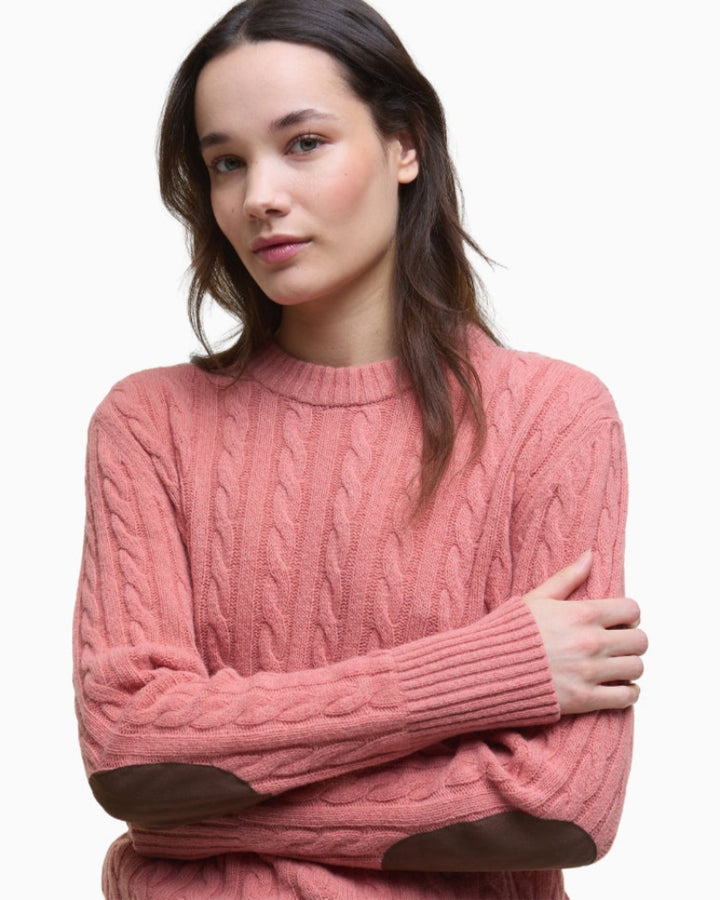 Side angle showing the cable-knit texture and fit of the jumper