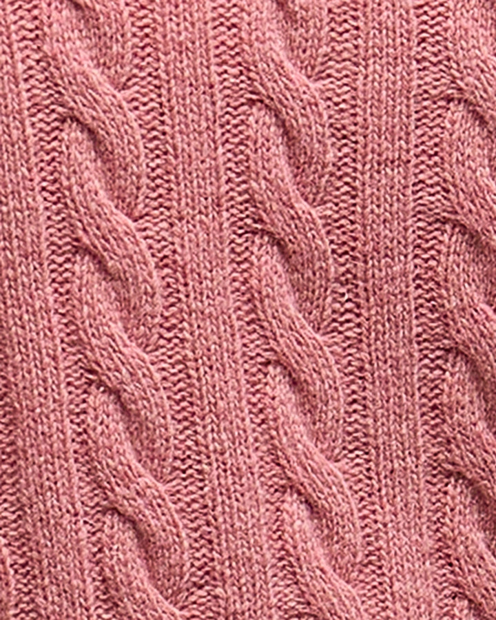Close-up of the cable knit detail and soft wool texture