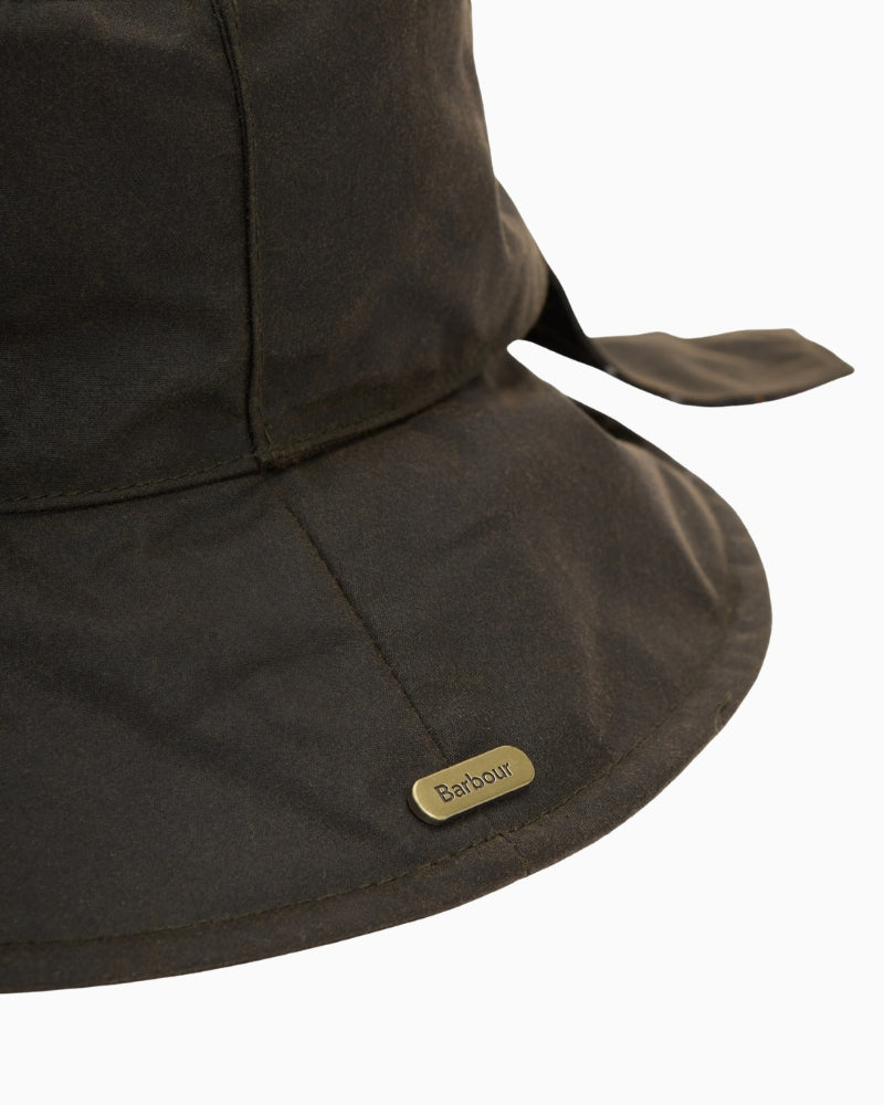 Barbour Brambling Wax Bucket Hat in Olive logo badge detail