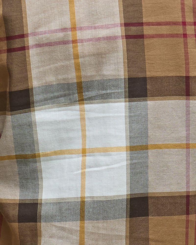 Fabric detail showing rich tartan pattern
