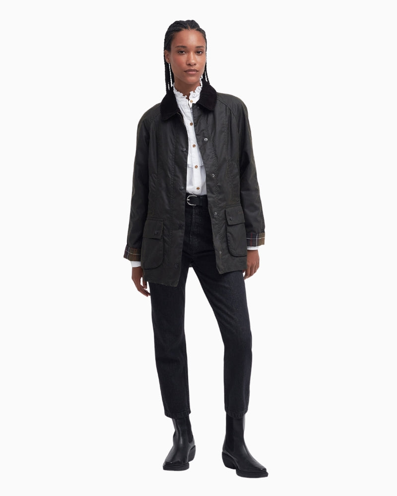 Outdoor lifestyle shot of Barbour wax jacket styled casually for Irish weather