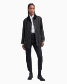 Outdoor lifestyle shot of Barbour wax jacket styled casually for Irish weather