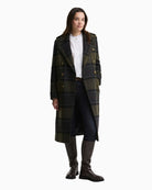 Barbour Cottemore checked wool coat styled with knee-high boots