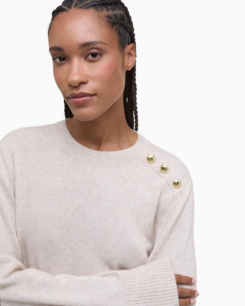 Close-up of branded buttons on shoulder mock placket of Eleanor jumper