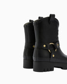 Pair of boots side by side on white background