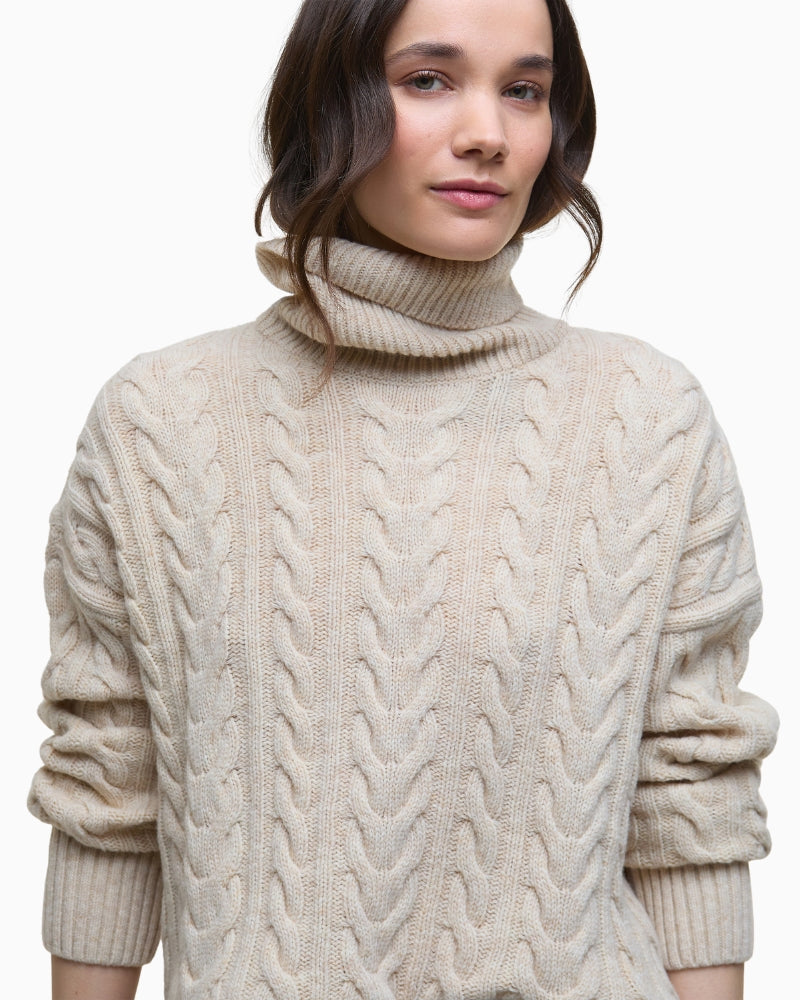 Cosy women’s rollneck jumper styled in soft beige tone