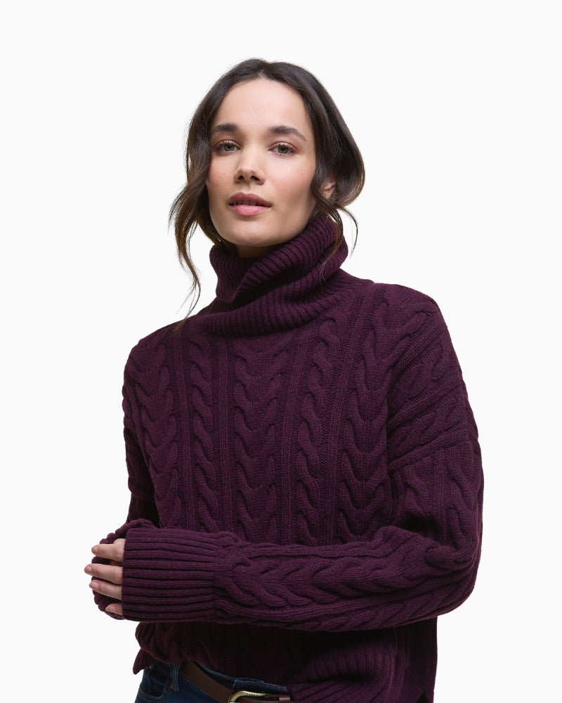 Chunky roll neck detail on Barbour jumper in cable knit wool blend