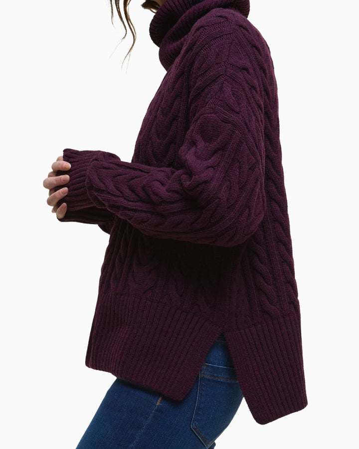 Sleeve and cuff detail showing ribbed knit and wool texture