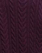 Close-up of cable knit detail on black cherry Barbour jumper
