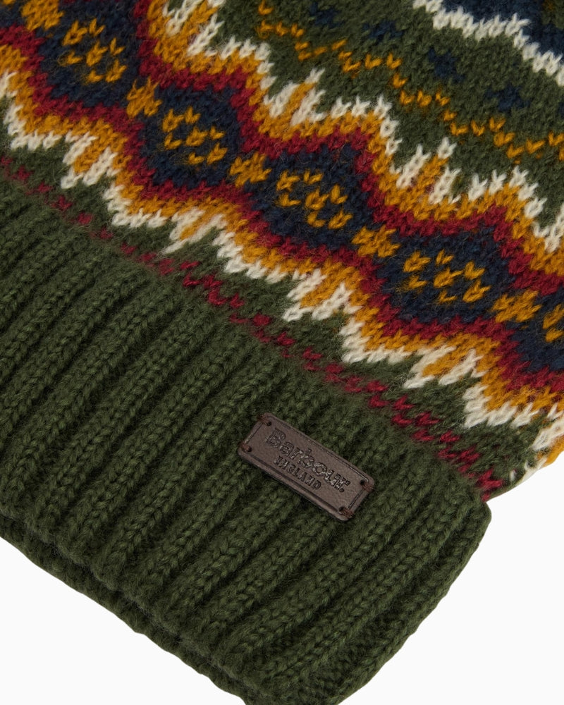 Closed-up of Barbour Fair Isle hat with badge detail