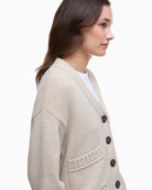 Side view of Barbour Faye cardigan showing cropped length and chunky knit texture