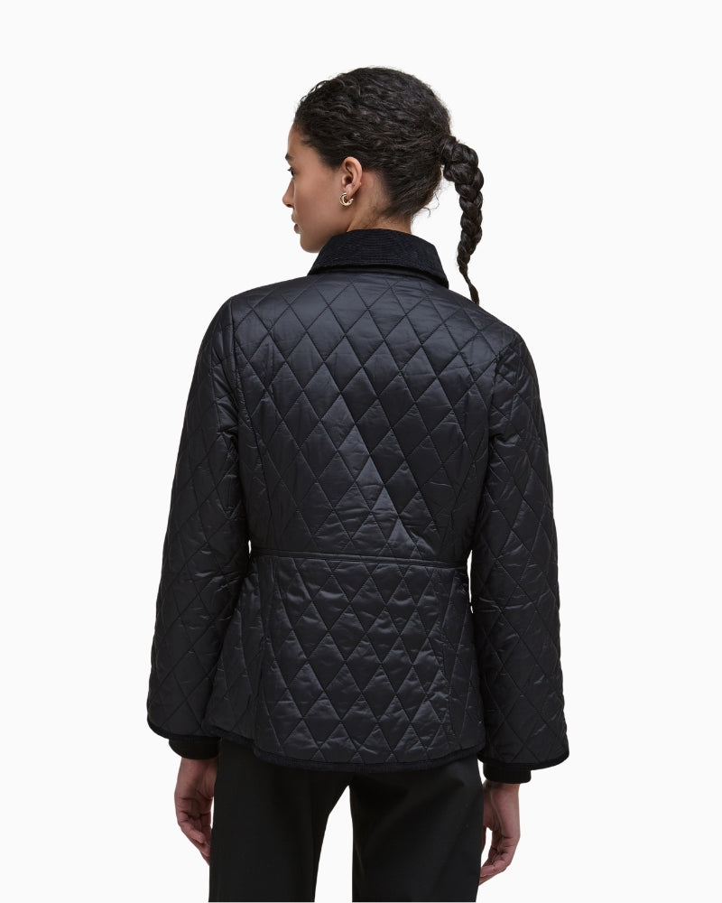 Back view of quilted jacket with corduroy collar and diamond stitching