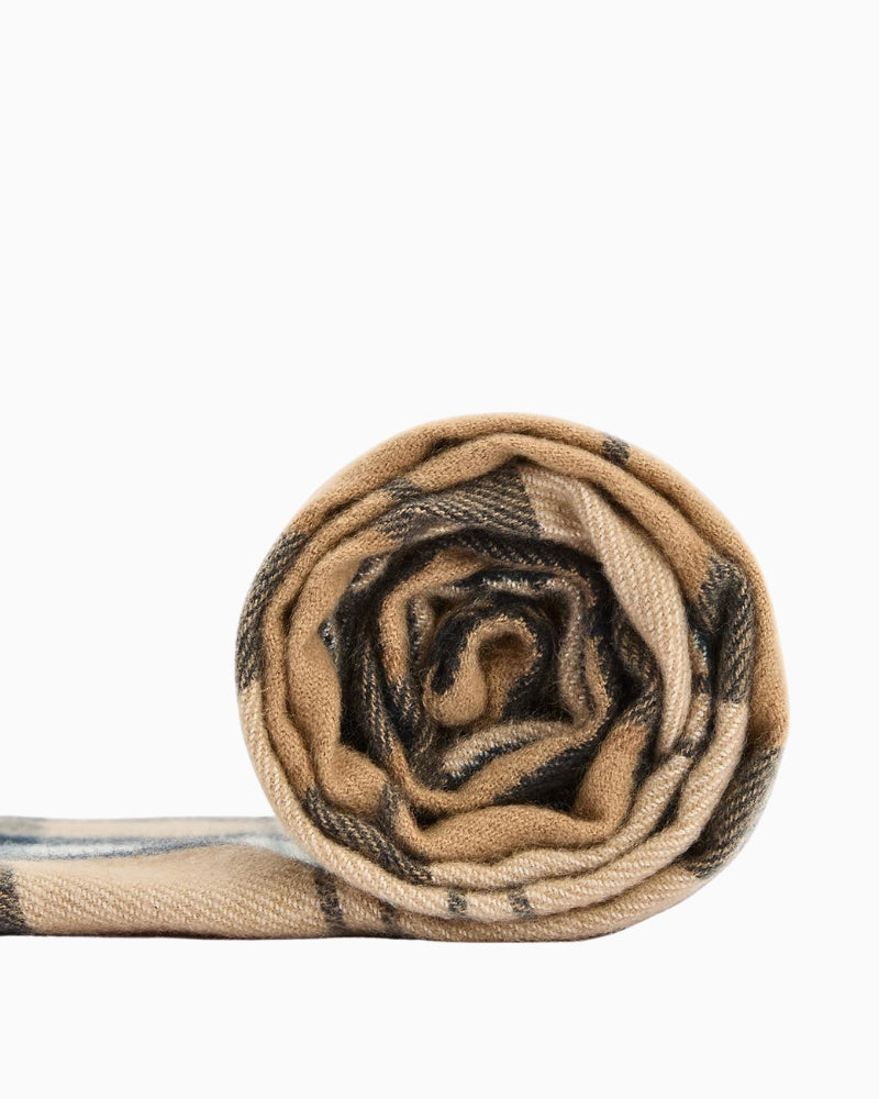 Rolled-up Barbour Hailes Tartan Scarf with tassel fringe detail