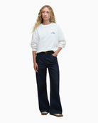 Model wearing sweatshirt with jeans – front angle