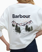 Close-up back logo and large scenic mountain embroidery