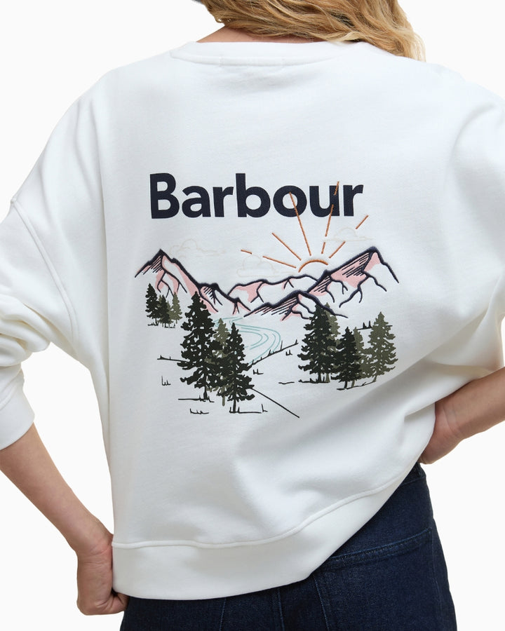 Close-up back logo and large scenic mountain embroidery
