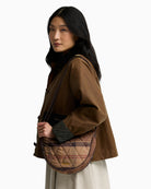 Barbour Healy Tartan Sling Bag in Tartan worn over the shoulder