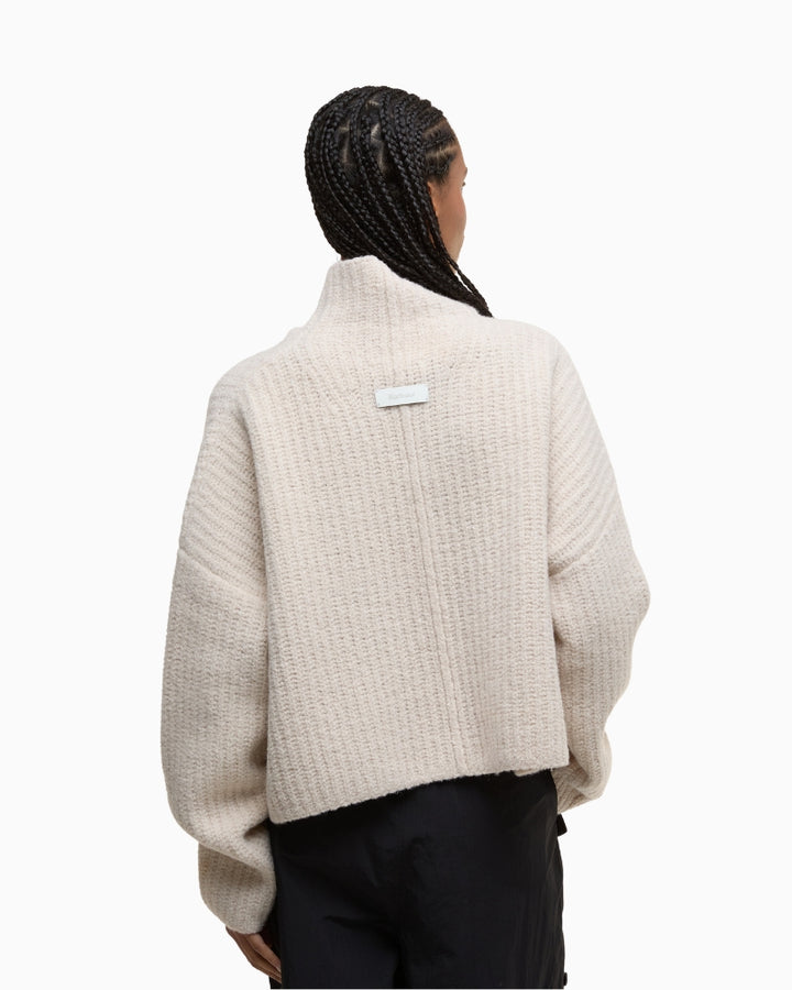 Back view showcasing relaxed fit and ribbed hem
