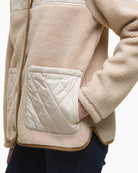 Side angle showing texture and pocket detail on fleece