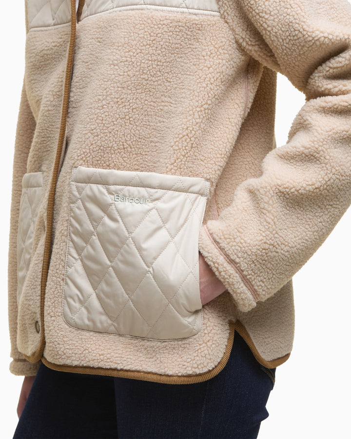 Side angle showing texture and pocket detail on fleece