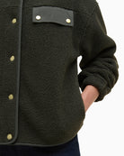 Side-seam pocket detail and stitching along hemline