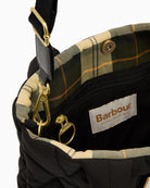 Interior view of Barbour Mariah Quilted Mini Tote in black showing roomy lining and secure opening